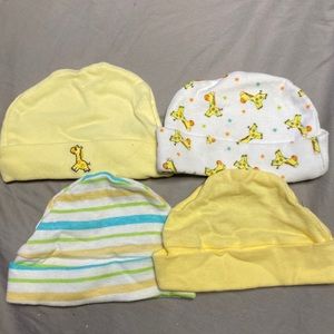 4 Newborn beanies. Soft pastel colors.